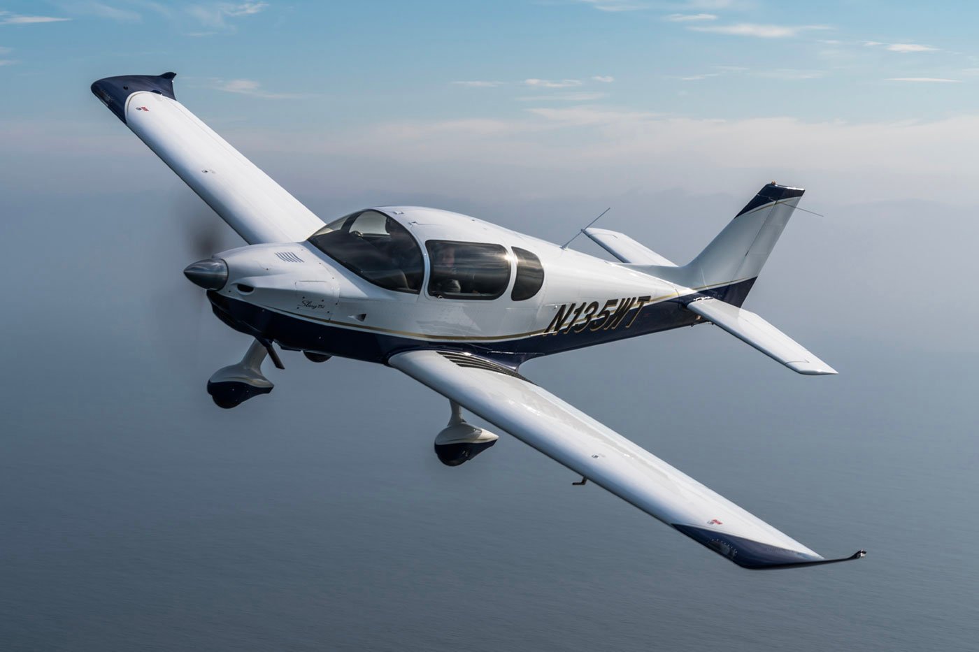 Sling TSi light-sport aircraft banking over coastline